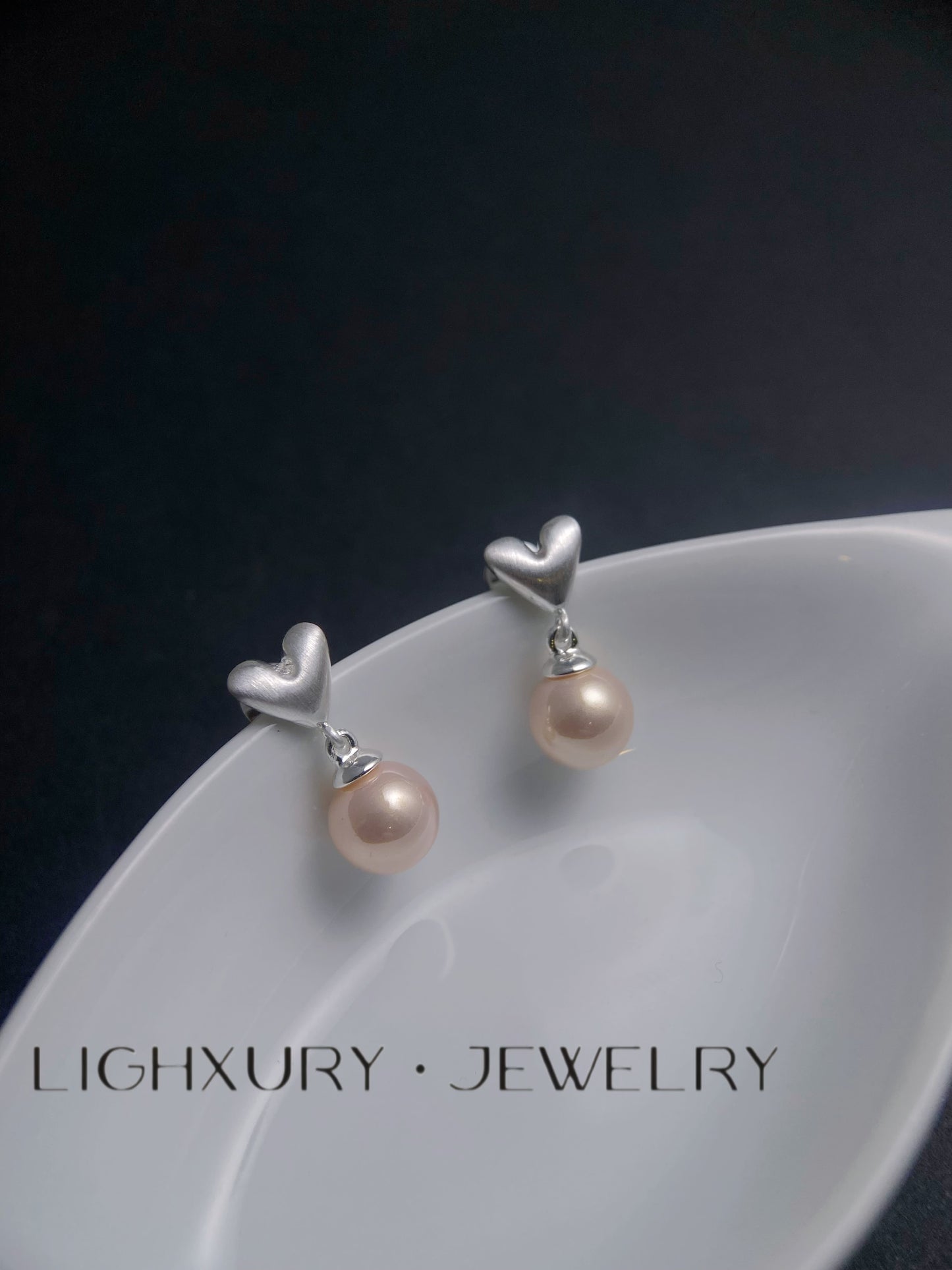 Silver Heart and Pink Pearl Drop Earrings: A Delicate and Alluring Creation