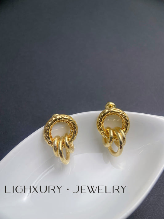 Golden Twisted Circle Earrings: A Geometric Masterpiece of Style