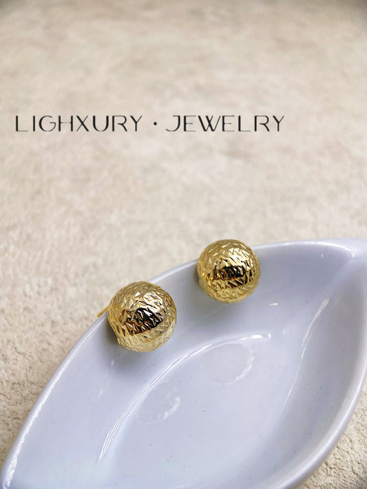 Golden Textured Sphere Earrings: A Captivating Ornament of Style