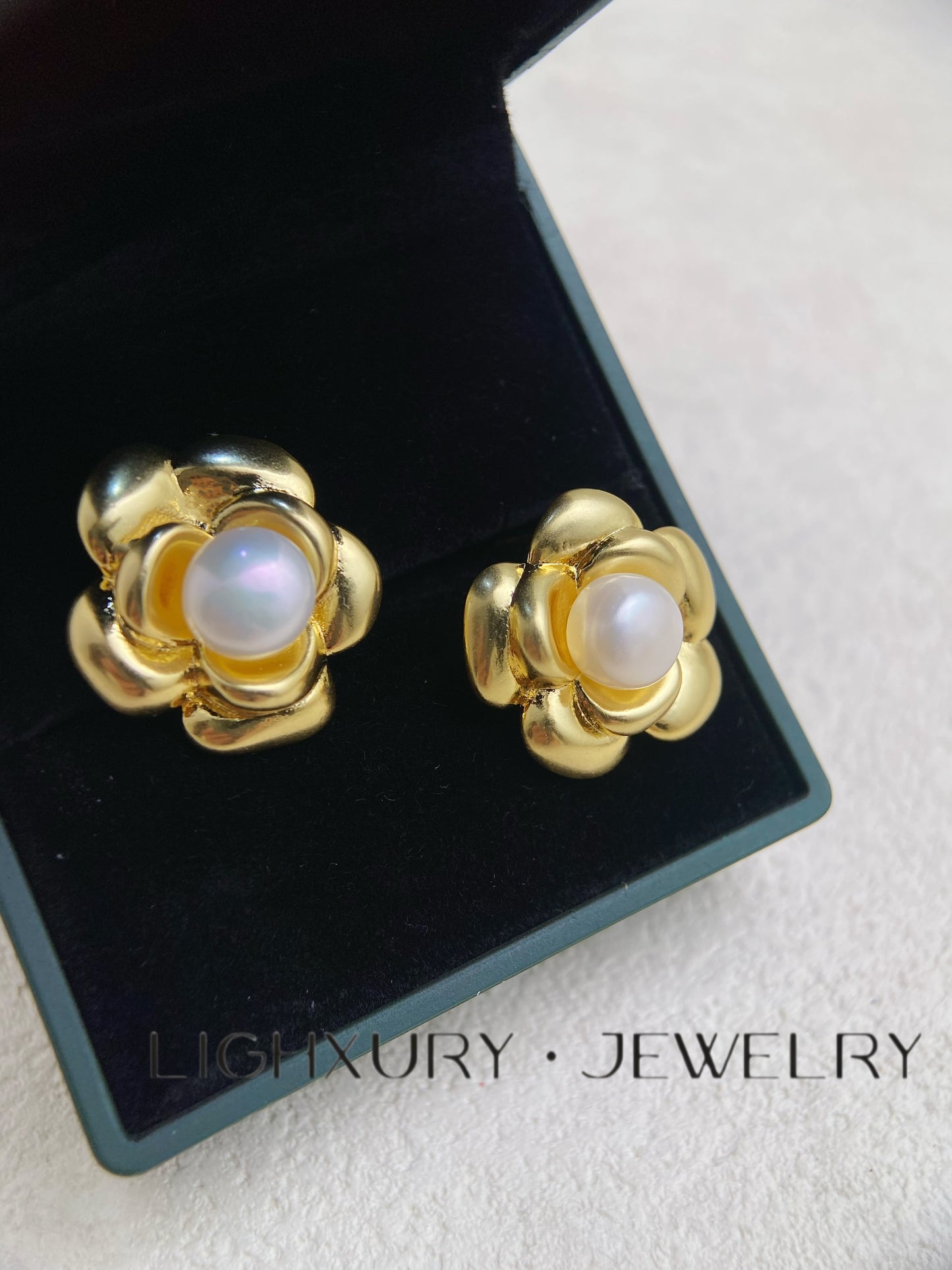 Golden Flower Earrings with a White Pearl Center: A Timeless Elegance